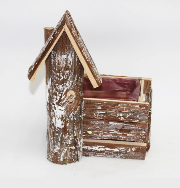 Wood bark birdhouse shape planters with snow