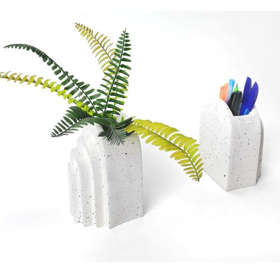 ceramic bookend with pen holder and artifiical plant